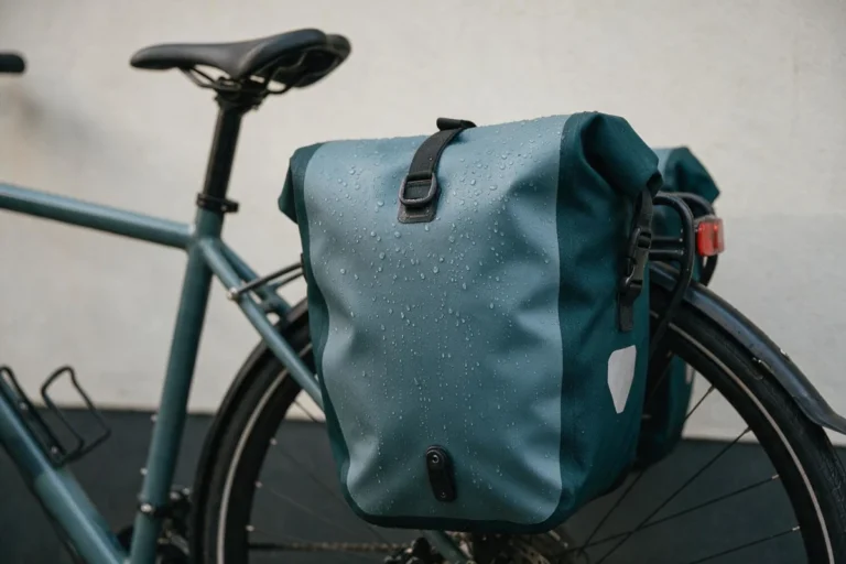 Waterproof pannier bag mounted on a rear rack